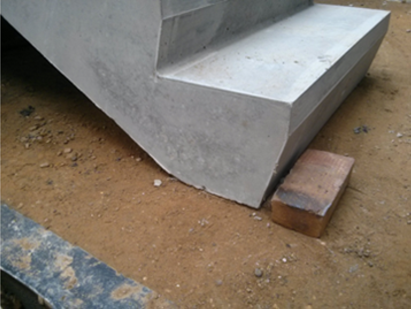 precast concrete stair resting on ground