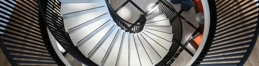 modern curved staircase in office building
