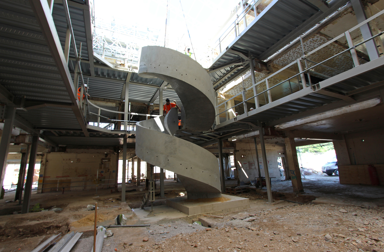 two precast concrete luxury spiral curved helical stairs staircase craned into position