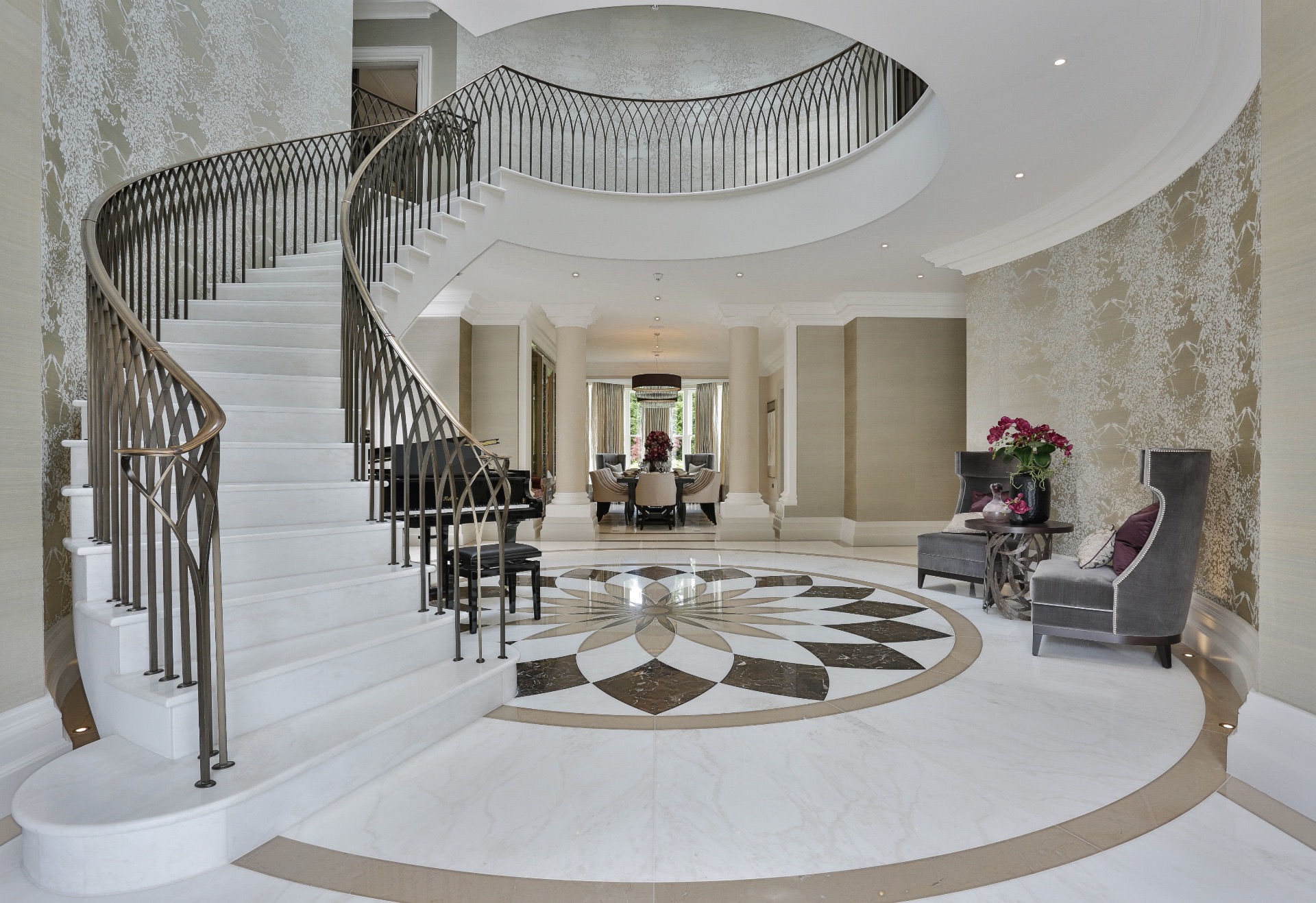 A luxury curved stair design into an open landing