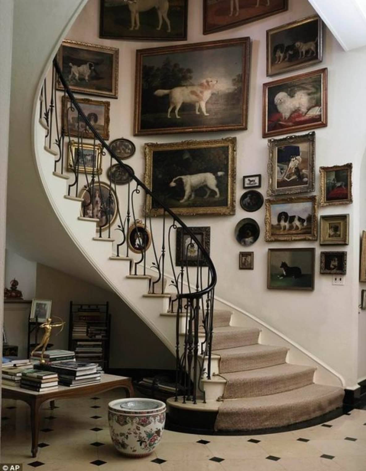 Picture gallery on a curved carpeted staircase