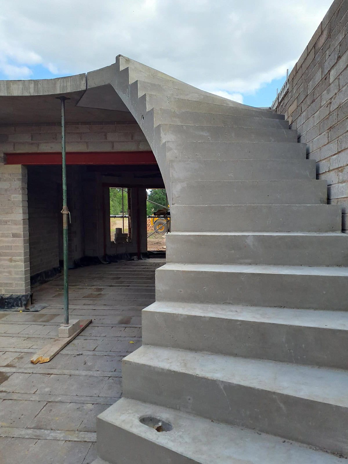 Kallisto concrete curved staircase single flight being installed
