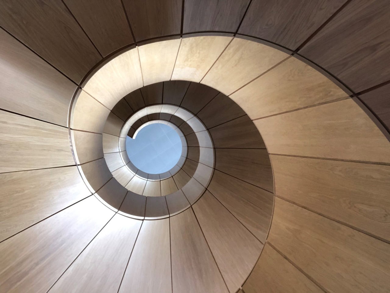 Artistic ground view of curved stair soffit