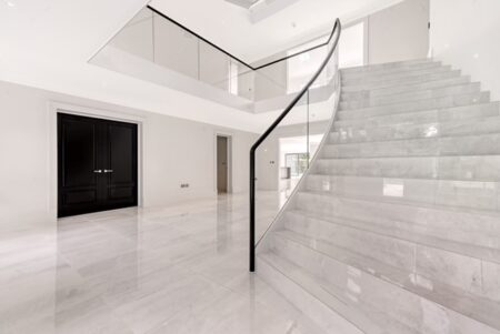 Close up view of marble clad luxury staircase Ridgeway Brentwood Essex