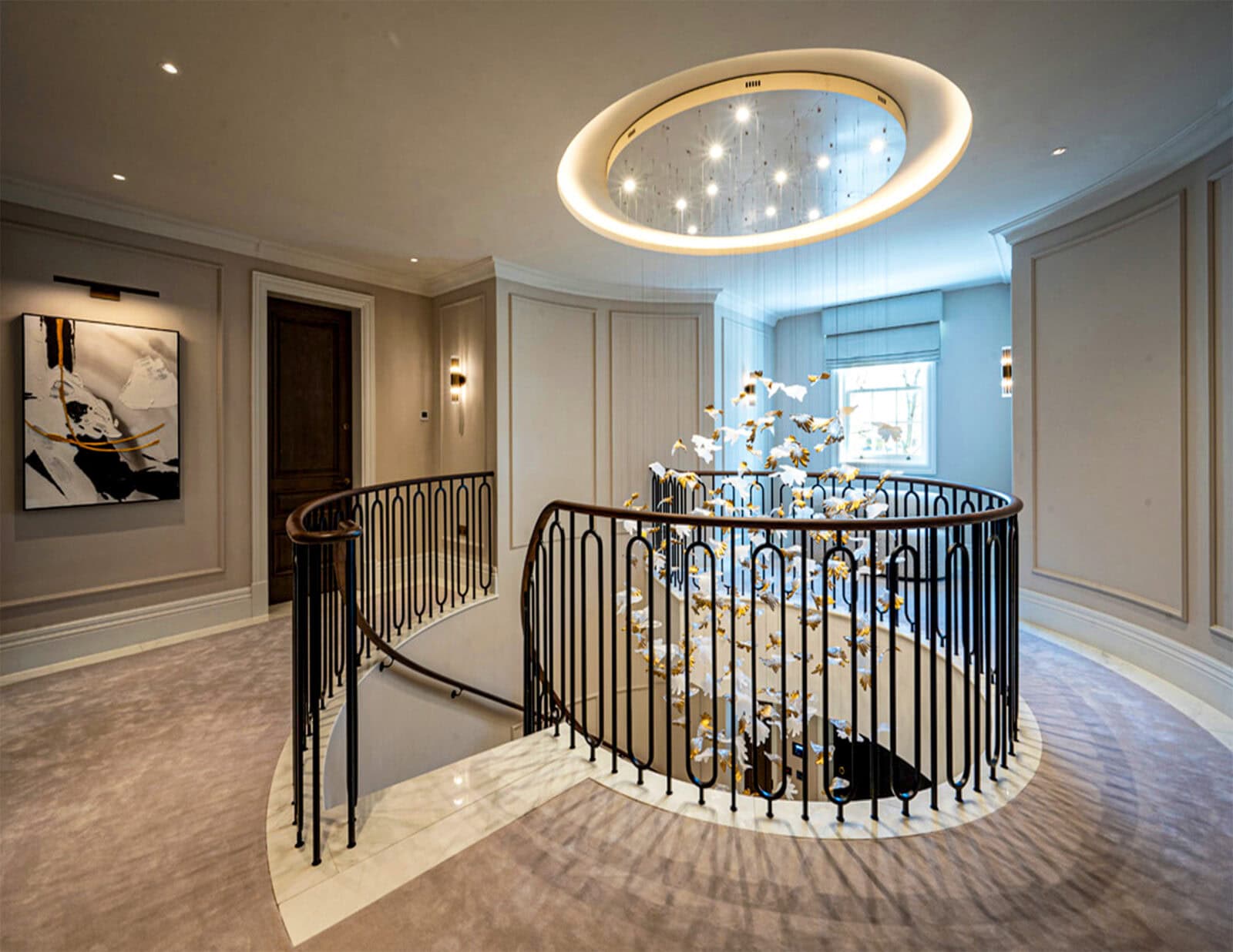 Curved landing in luxury UK home with helical staircase