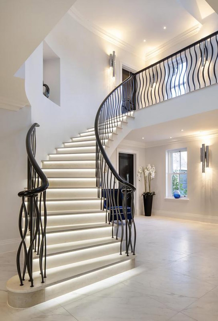 Entrance hall of luxury home with sweeping curved staircase with LED tread lighting Ellwood Grange Beaconsfield