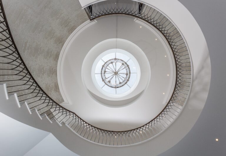Skylight above curved staircase kings chase oxshott
