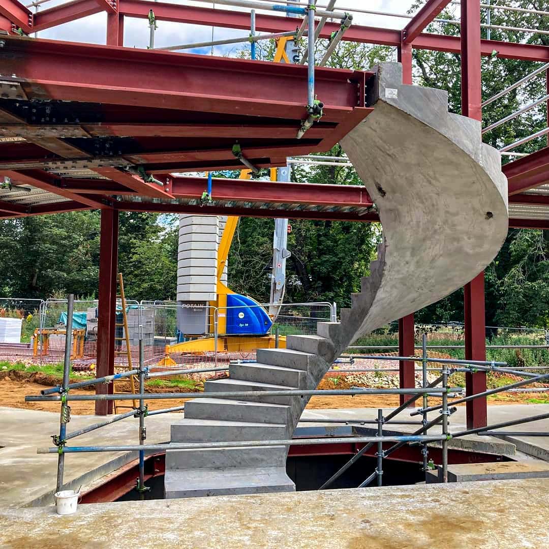 Twisting helical staircase installed in steel frame of luxury UK home