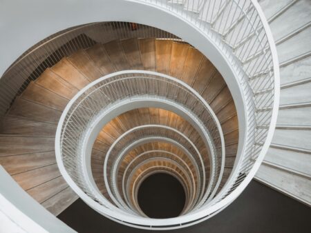 white spiral staircase with wooden steps