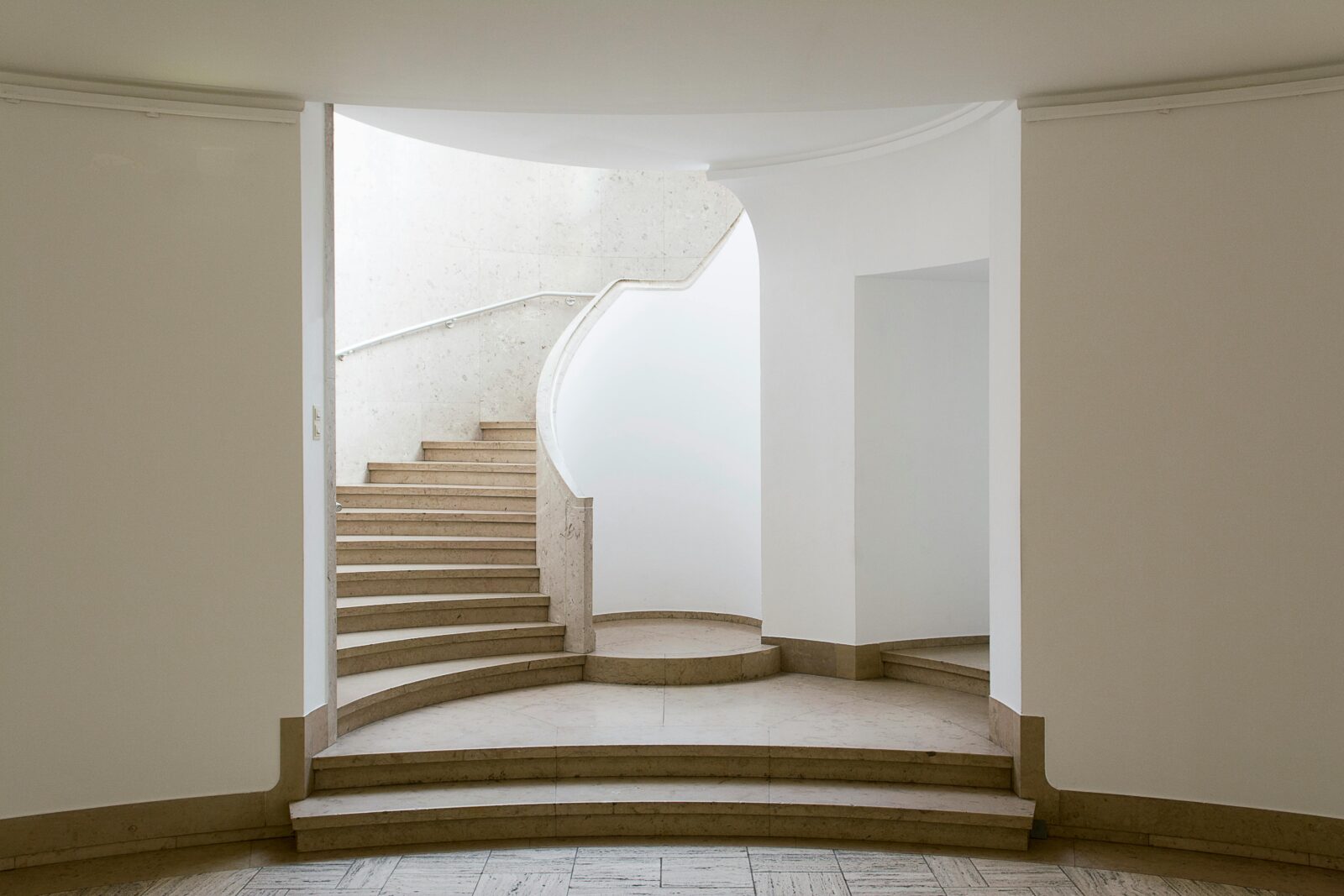 Marble staircase in beige with white walls